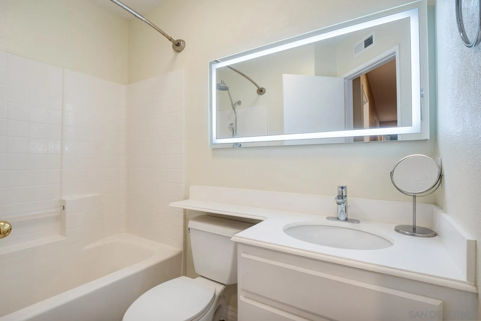 5512 Renaissance Avenue, Unit 3 San Diego, CA 92122 - Photo 25 of 57 a bathroom with a sink toilet and shower