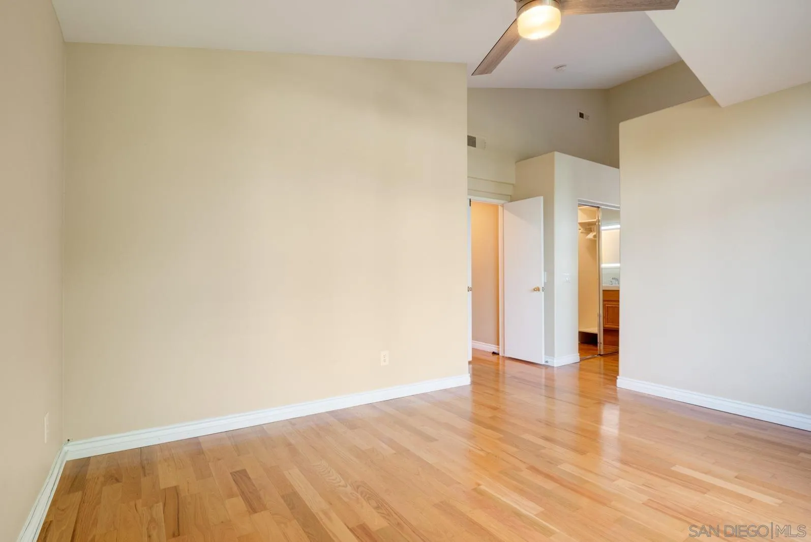 5512 Renaissance Avenue, Unit 3 San Diego, CA 92122 - Photo 30 of 57 a view of an empty room with wooden floor