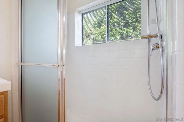 a view of a storage & utility room with two washing machine