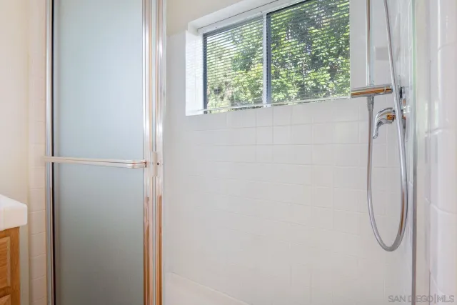 a view of a storage & utility room with two washing machine