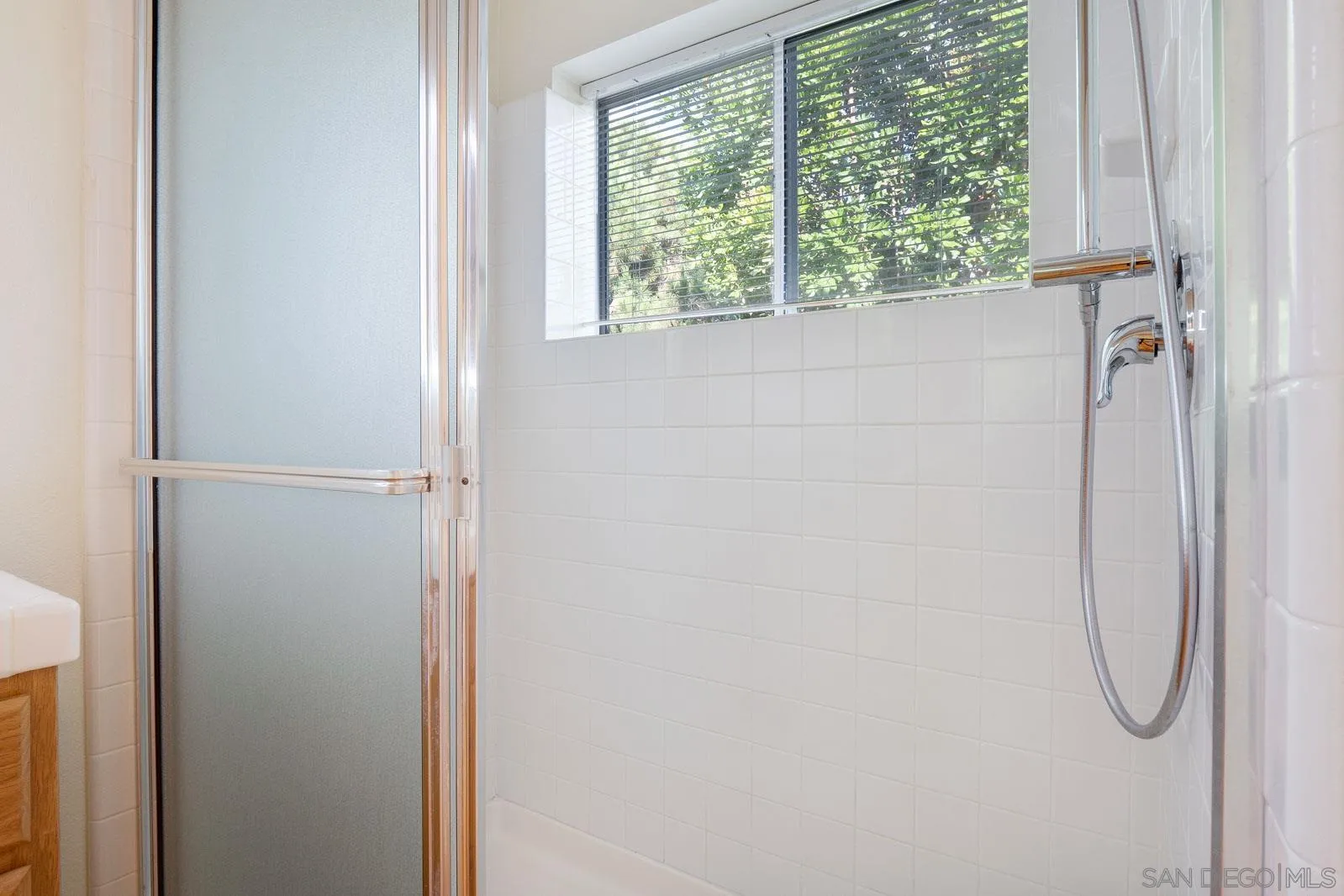 5512 Renaissance Avenue, Unit 3 San Diego, CA 92122 - Photo 35 of 57 a bathroom with a glass shower door