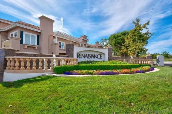 a view of house with backyard and garden