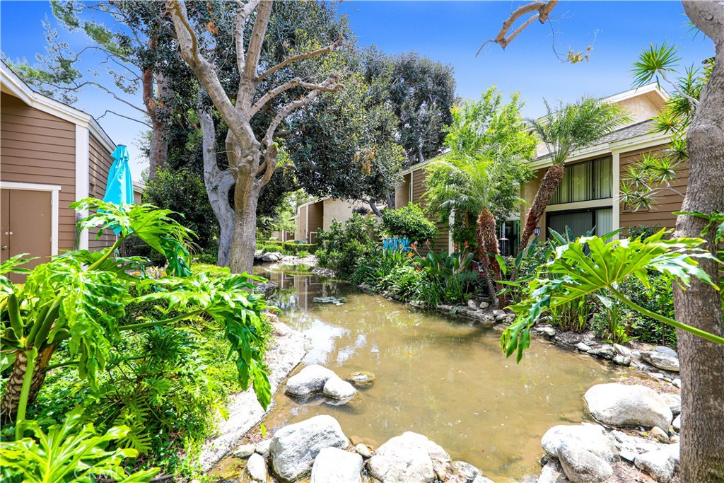 Welcome to your new private lakeside tropical oasis in The Lakes of Irvine!