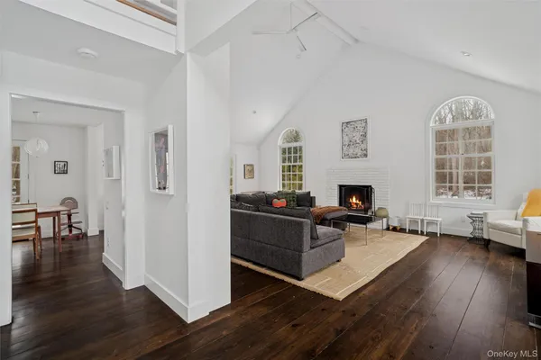 a living room with furniture a window and a fireplace
