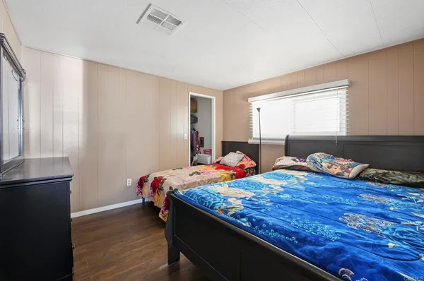 a bed room with a bed and a window