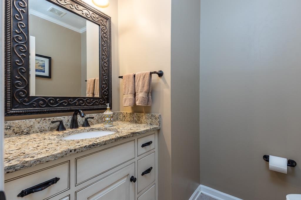 1725 John Ridge Drive Collierville, TN 38017 - Photo 16 of 34 a bathroom with a granite countertop sink and a mirror
