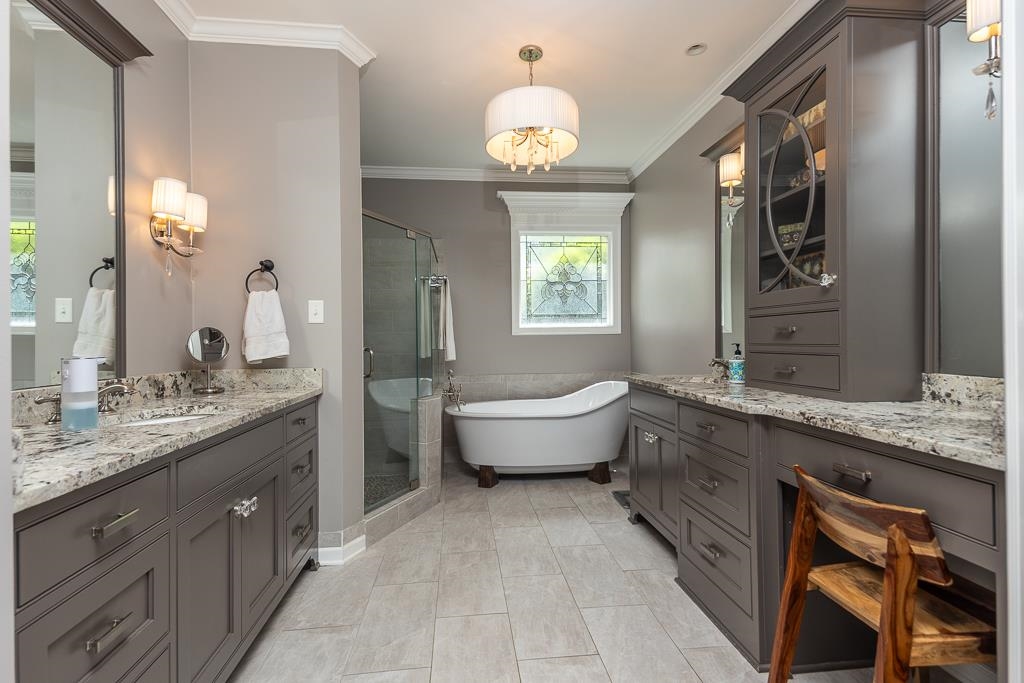 1725 John Ridge Drive Collierville, TN 38017 - Photo 18 of 34 a spacious bathroom with a granite countertop double vanity sink a mirror and a bathtub