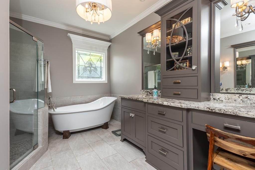 1725 John Ridge Drive Collierville, TN 38017 - Photo 19 of 34 a bathroom with a granite countertop sink mirror and bathtub