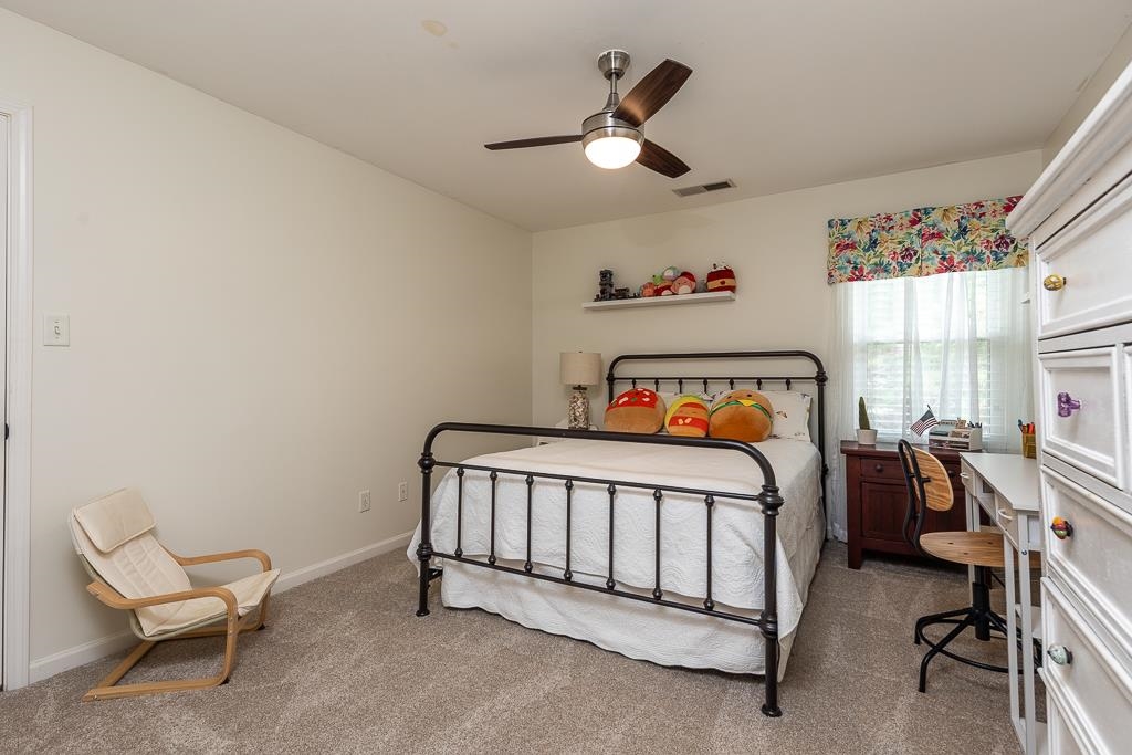 1725 John Ridge Drive Collierville, TN 38017 - Photo 25 of 34 a bedroom with a bed and a window