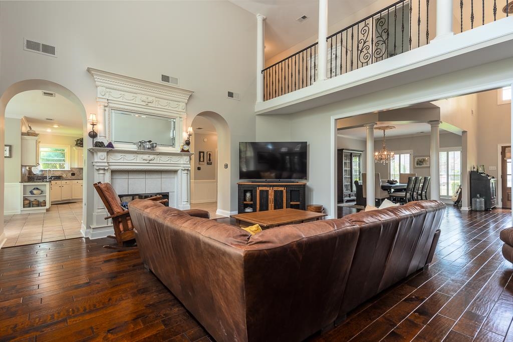 1725 John Ridge Drive Collierville, TN 38017 - Photo 5 of 34 a living room with stainless steel appliances furniture a fireplace and a kitchen view