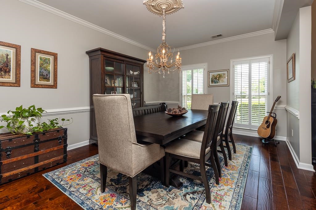1725 John Ridge Drive Collierville, TN 38017 - Photo 7 of 34 a view of a dining room with furniture and wooden floor