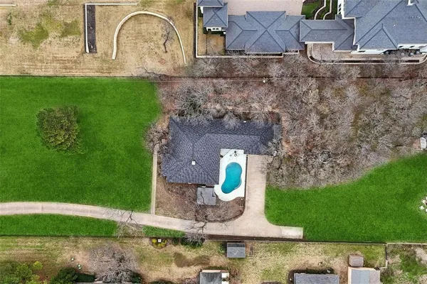 a aerial view of a house with garden space and street view