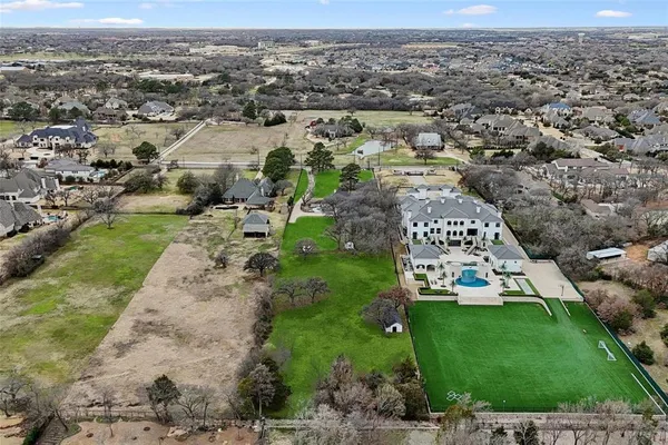 an aerial view of a house with a garden