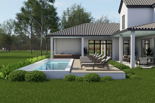 a view of a house with a patio and a yard