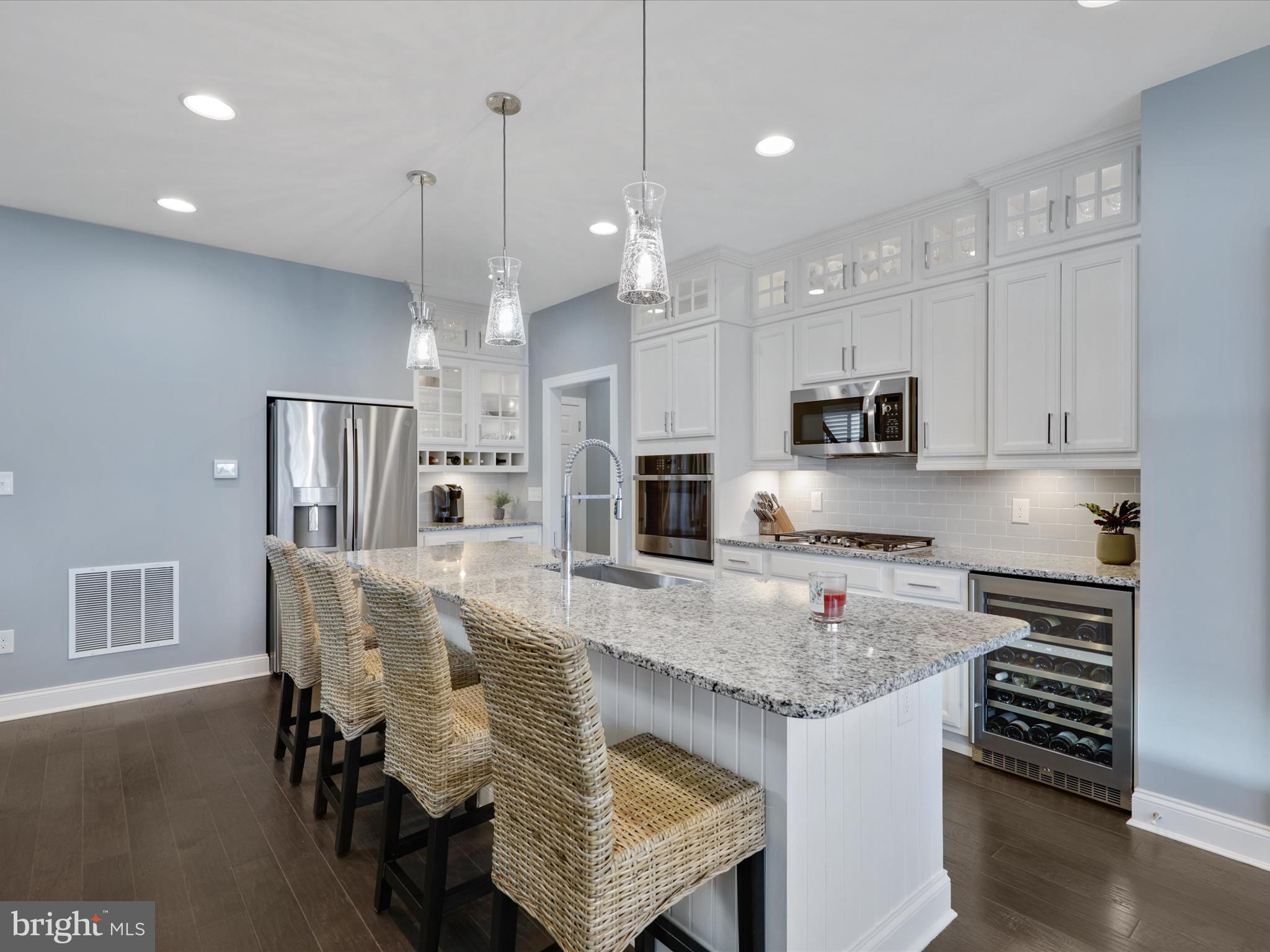 11893 Haslet Road Lewes, DE 19958 - Photo 13 of 59 Kitchen with Wall Oven & Wine Fridge