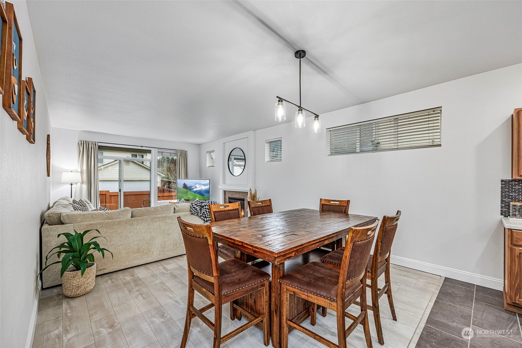 8975 Campus Meadows Loop Northeast Lacey, WA 98516 - Photo 20 of 36 a view of a dining room with furniture window and wooden floor
