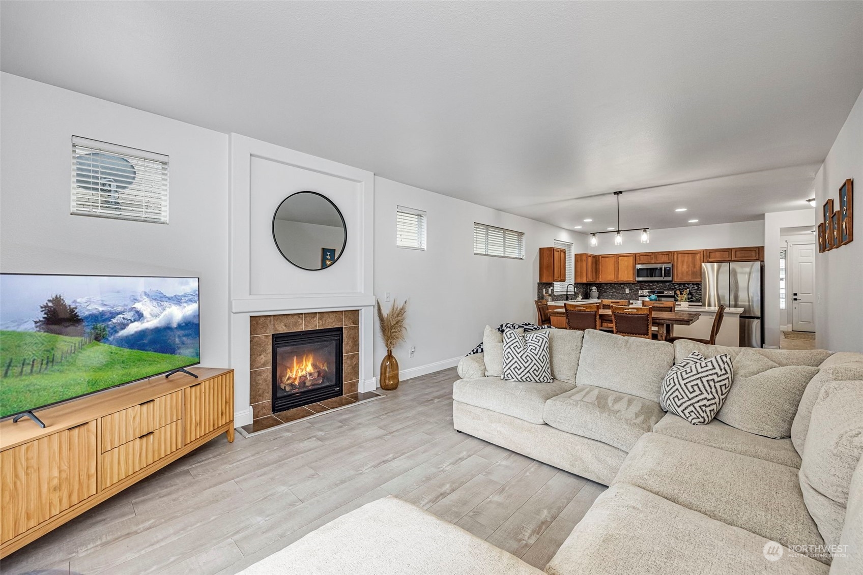 8975 Campus Meadows Loop Northeast Lacey, WA 98516 - Photo 27 of 36 a living room with furniture and a fireplace