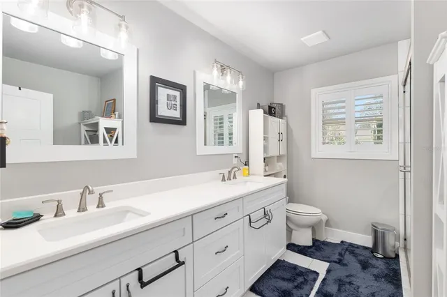 a front view of a house with swimming pool having outdoor seating