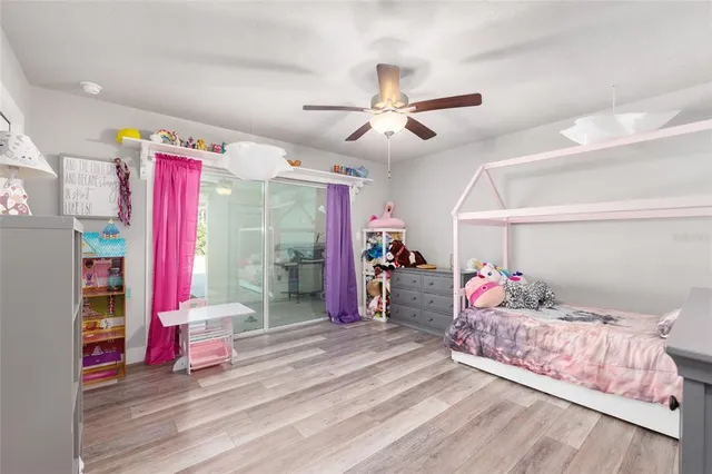 a view of a house with pool and sitting area