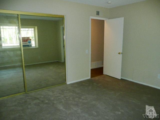 5332 Parkmor Road Calabasas, CA 91302 - Photo 4 of 10 an empty room with windows and closet