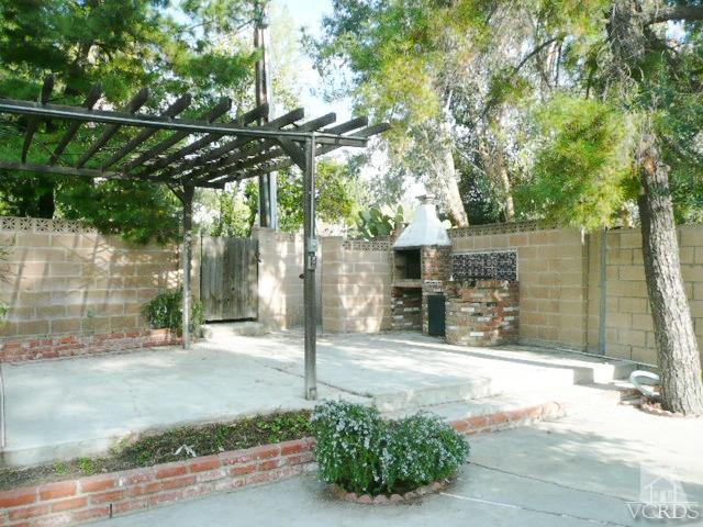 5332 Parkmor Road Calabasas, CA 91302 - Photo 8 of 10 a front view of a house with a yard