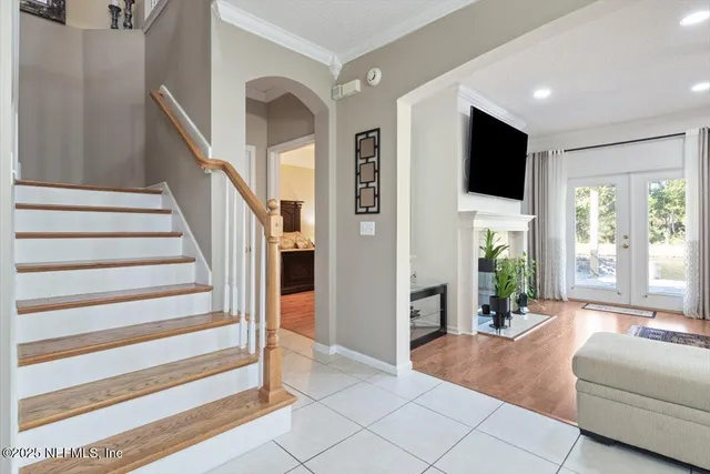 a living room with furniture fireplace and flat screen tv