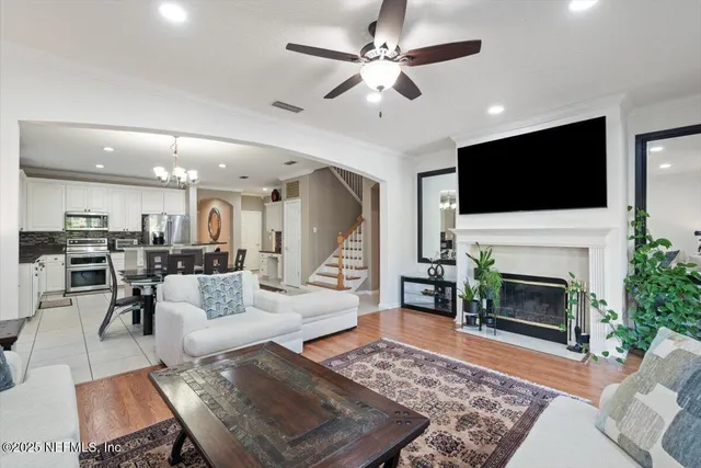 a view of a house with pool and sitting area