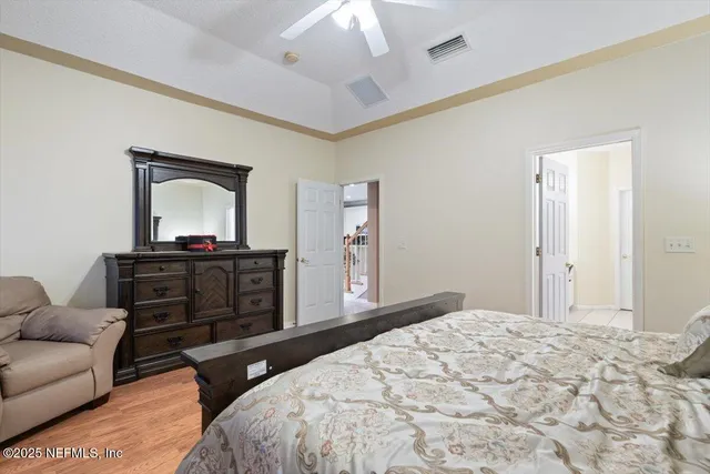 an aerial view of a house with a garden and lake view