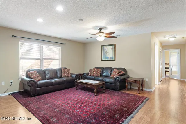 an aerial view of a house with outdoor space and lake view