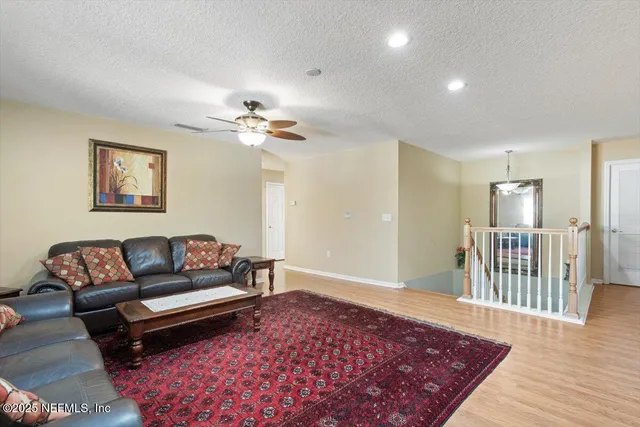 an aerial view of residential houses with outdoor space and lake view