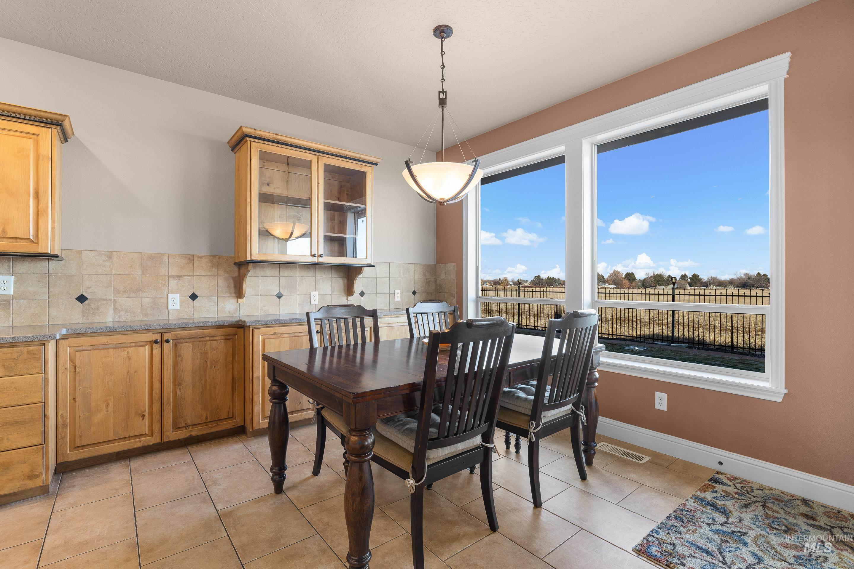 2208 East Sicily Street Meridian, ID 83642 - Photo 14 of 50 Dining room with light tile patterned floors and a textured ceiling