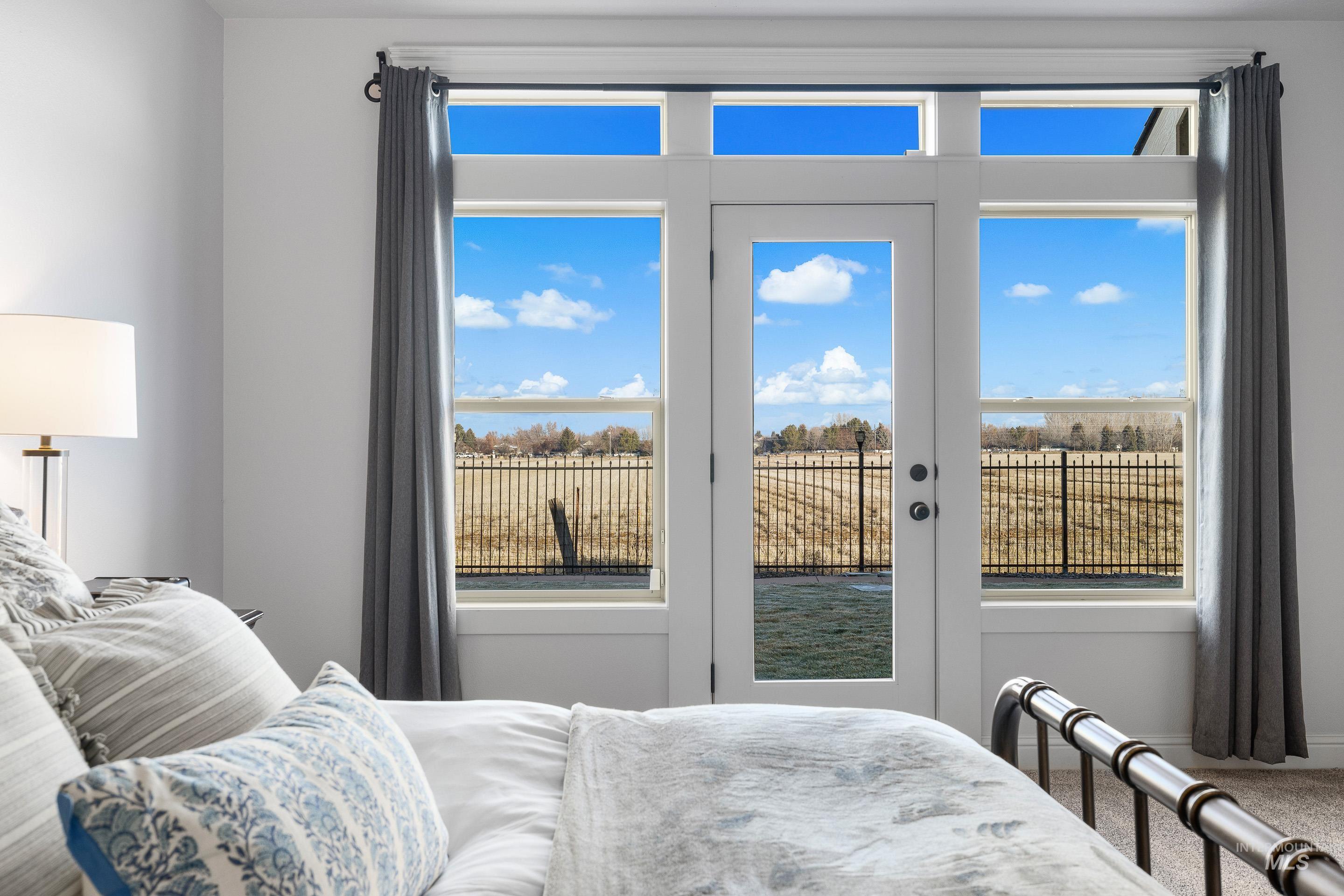 2208 East Sicily Street Meridian, ID 83642 - Photo 23 of 50 Bedroom featuring access to outside and multiple windows