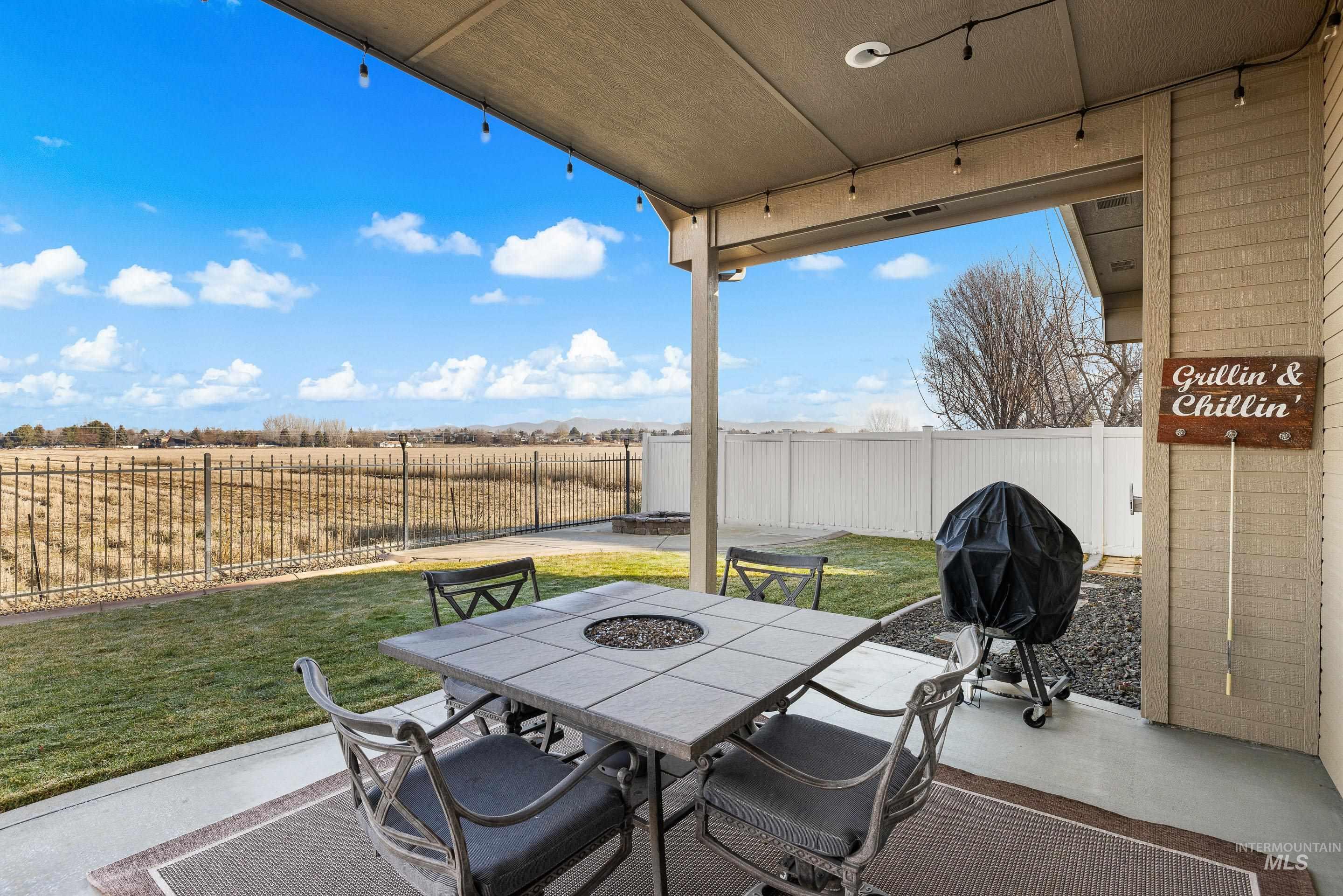 2208 East Sicily Street Meridian, ID 83642 - Photo 44 of 50 Fenced backyard with grilling area, a patio, and outdoor dining space