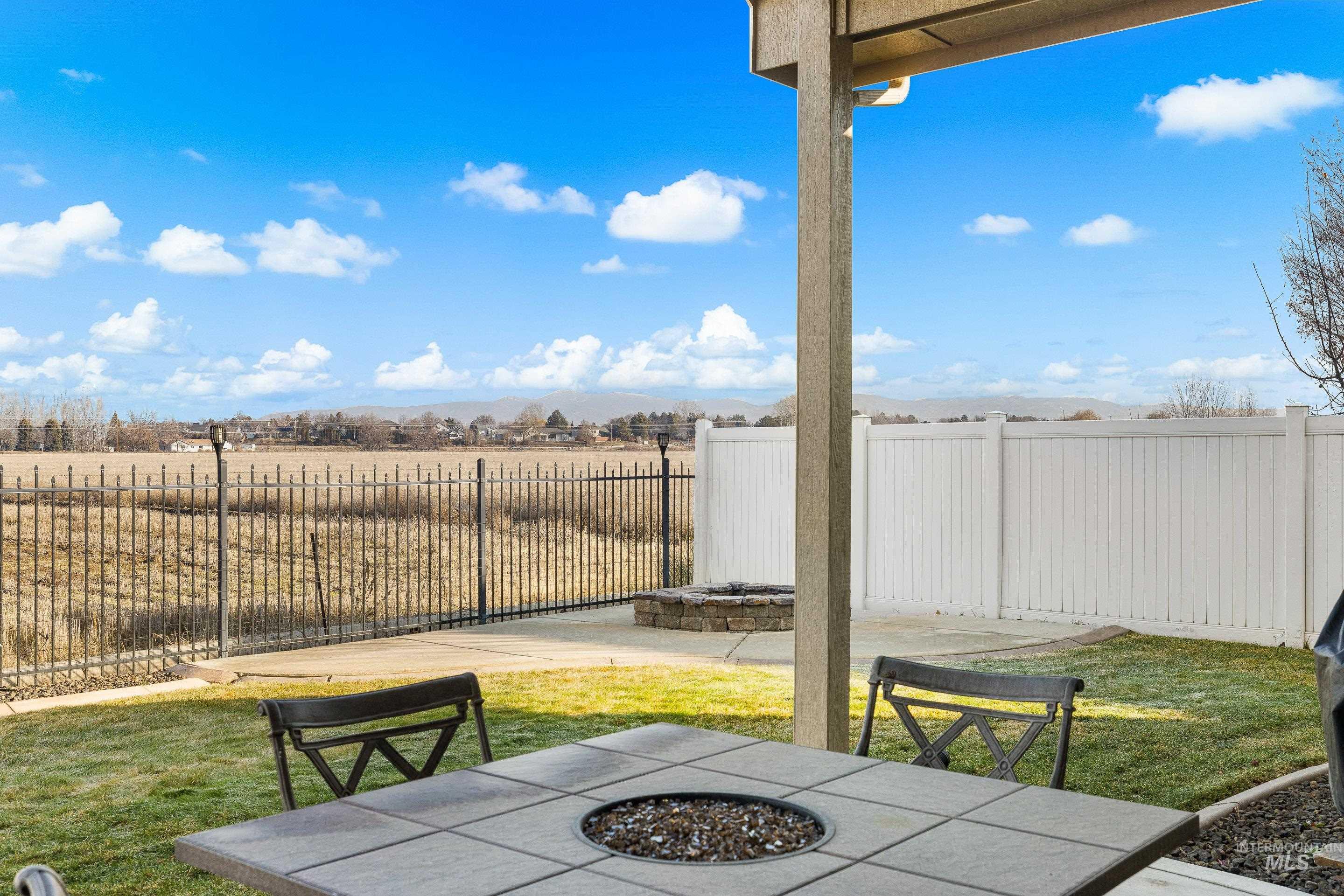2208 East Sicily Street Meridian, ID 83642 - Photo 45 of 50 Fenced backyard featuring an outdoor fire pit and a patio area