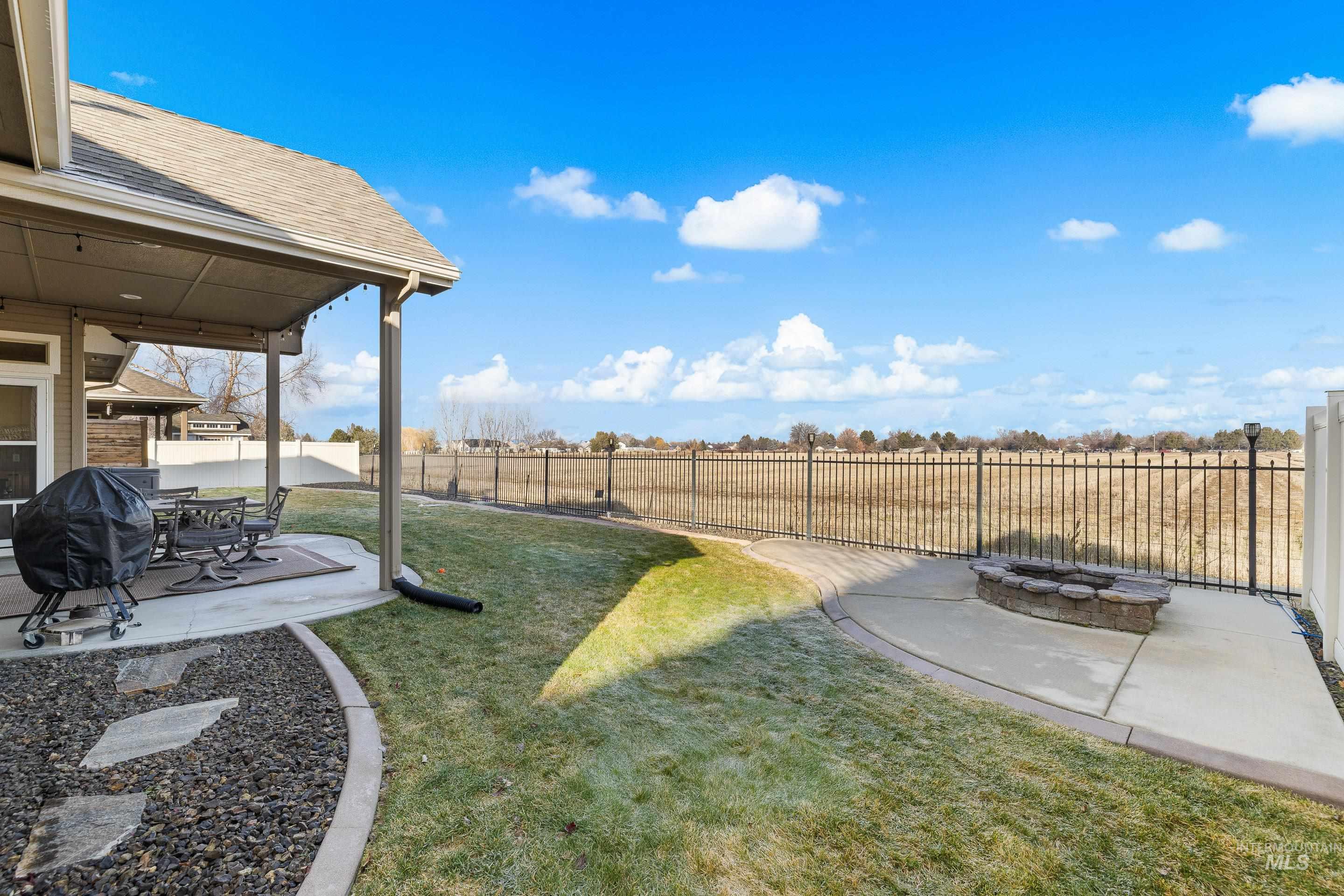 2208 East Sicily Street Meridian, ID 83642 - Photo 46 of 50 Fenced backyard with a patio and an outdoor fire pit