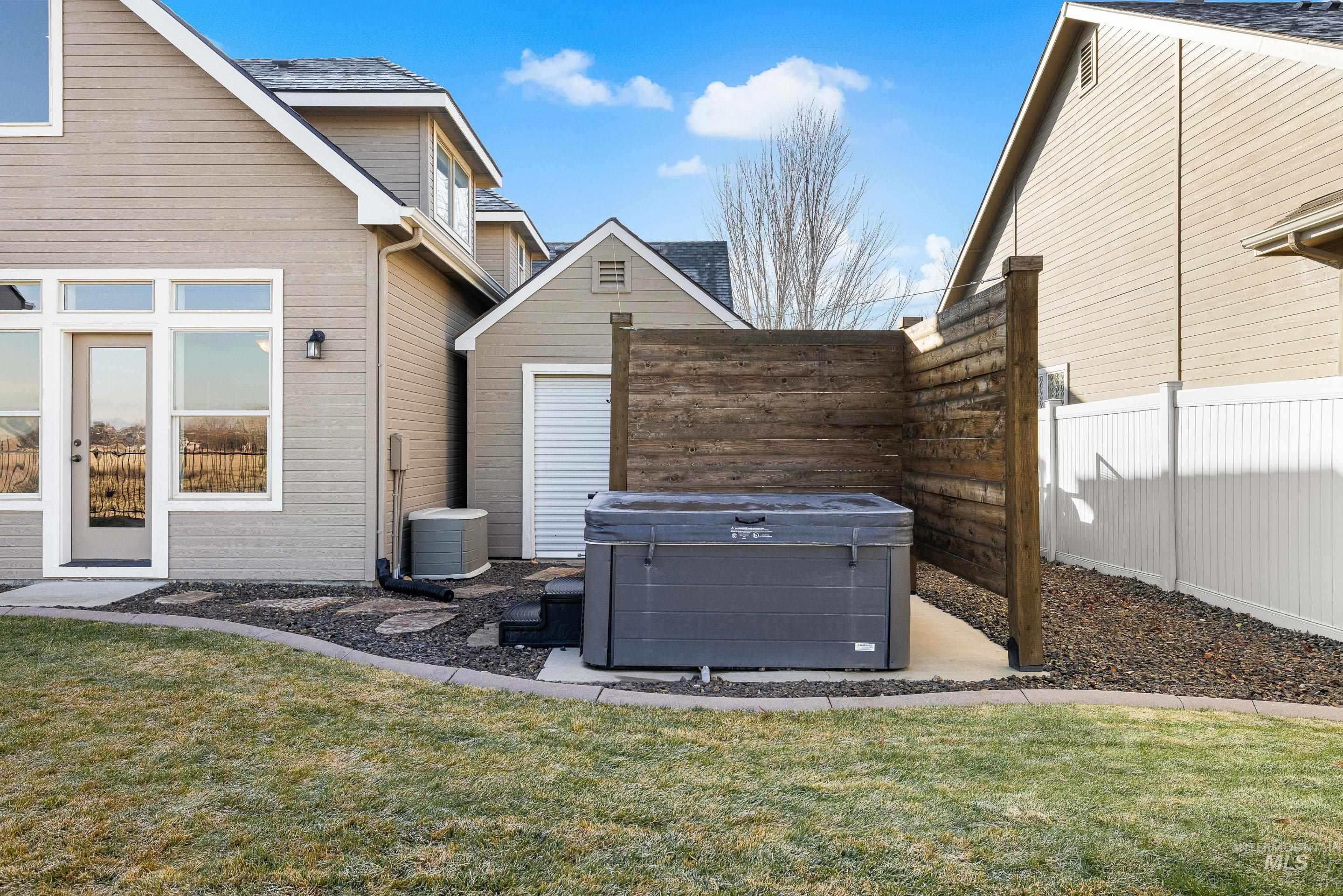 2208 East Sicily Street Meridian, ID 83642 - Photo 48 of 50 Exterior view of a downspout, a hot tub, and gutters