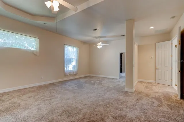 en empty room with windows and closet