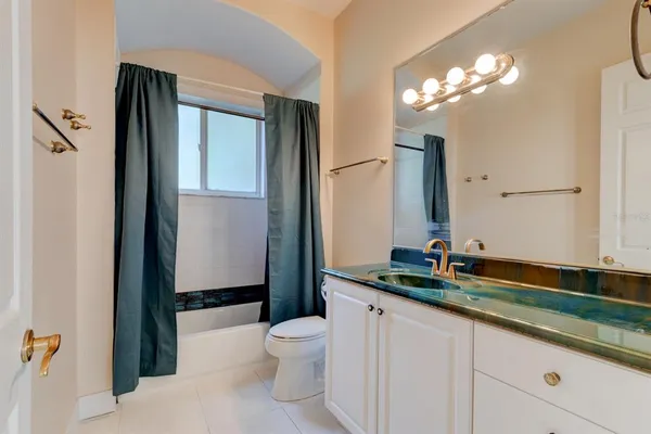 a utility room with cabinets washer and dryer