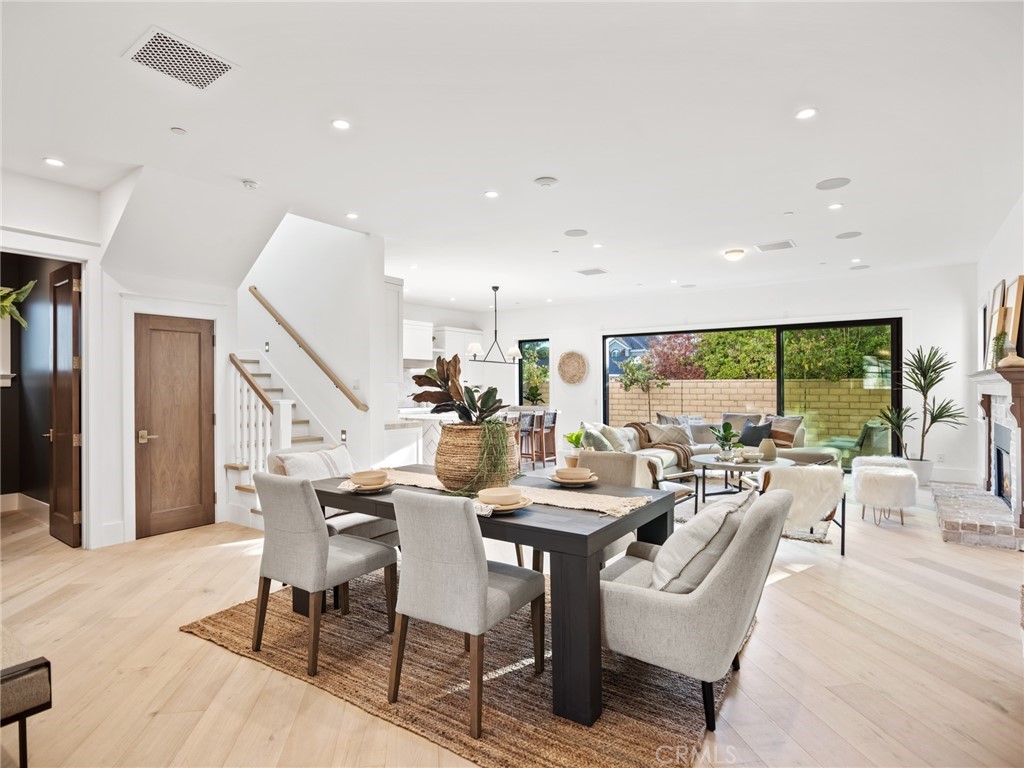 379 La Perle Place Costa Mesa, CA 92627 - Photo 3 of 8 a living room with lots of furniture and a large window