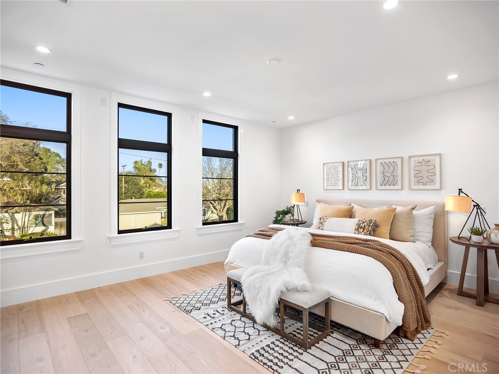 379 La Perle Place Costa Mesa, CA 92627 - Photo 4 of 8 a bedroom with double bed and a window