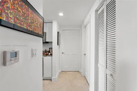 a view of a hallway with closet