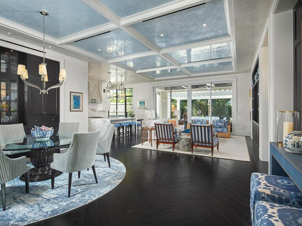 167 4th Street North Naples, FL 34102 - Photo 2 of 33 a view of a livingroom with furniture wooden floor and windows