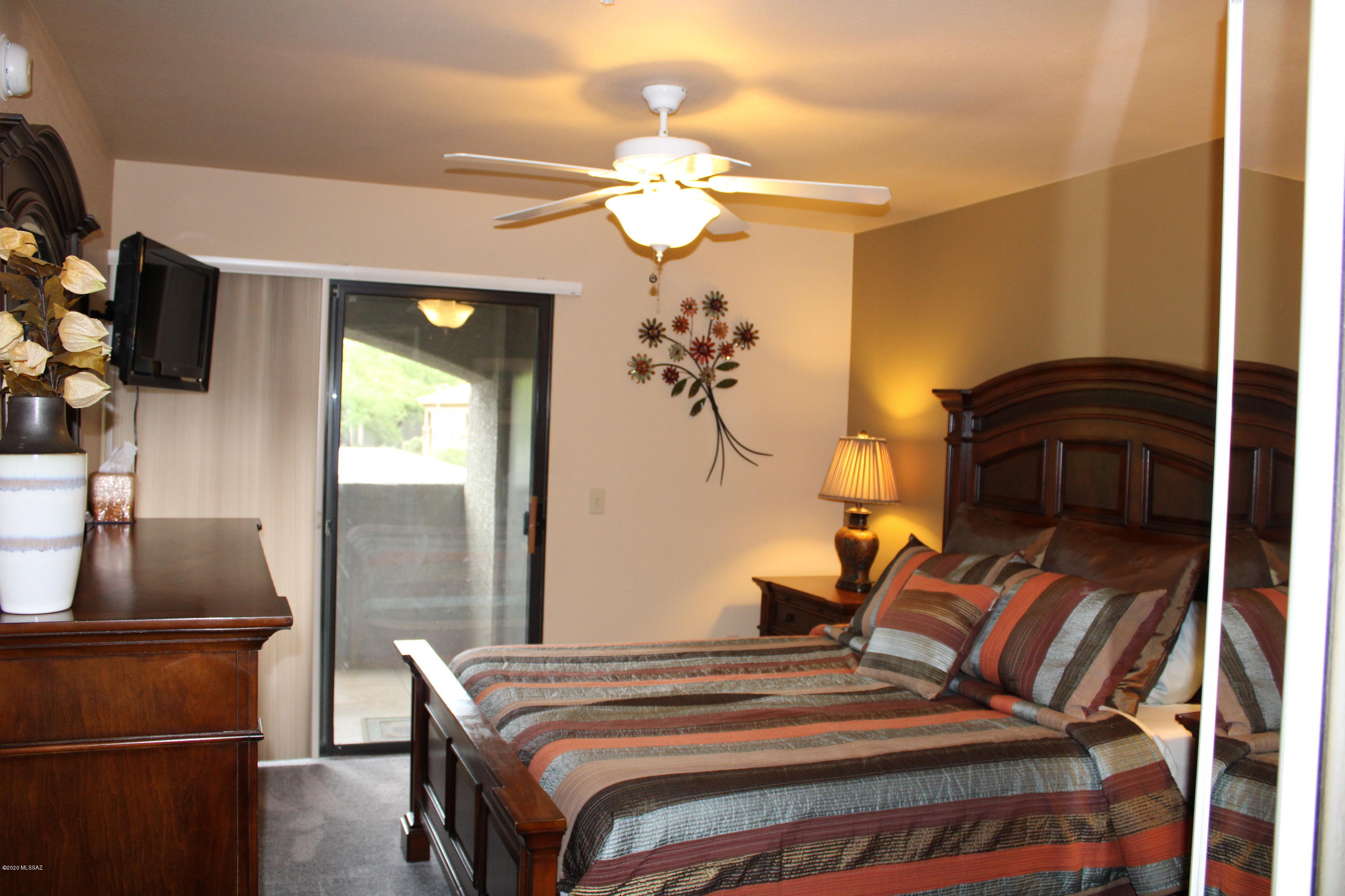 5751 North Kolb Road, Unit 36203 Tucson, AZ 85750 - Photo 12 of 25 a bedroom with a bed and a flat screen tv