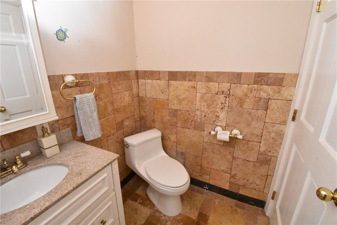 424 Grape Street Whitehall, PA 18052 - Photo 38 of 50 This bathroom features tile floors and walls, with a vanity and toilet.