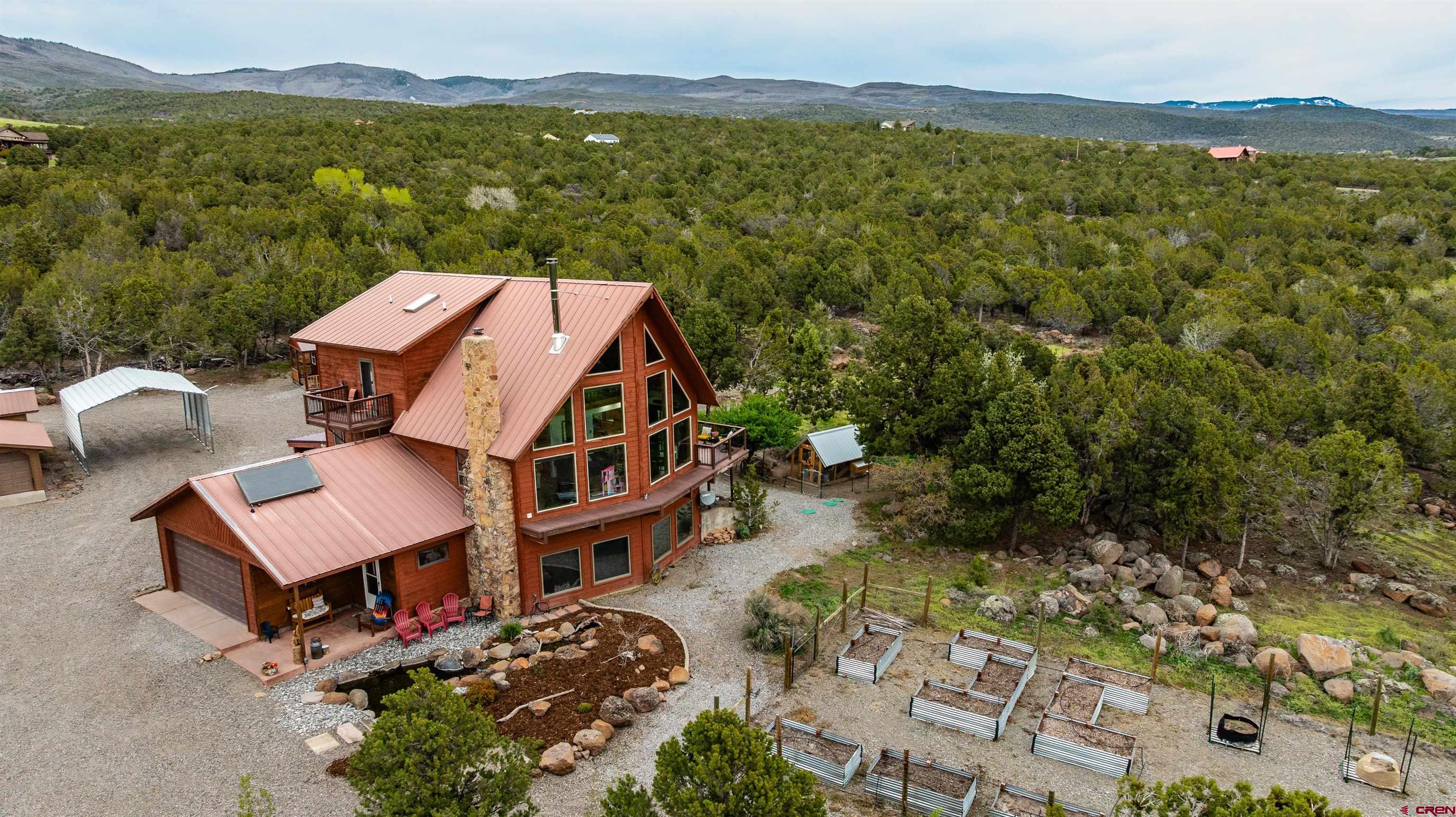 21186 Uintah Road Cedaredge, CO 81413 - Photo 41 of 45 an aerial view of a house with a garden