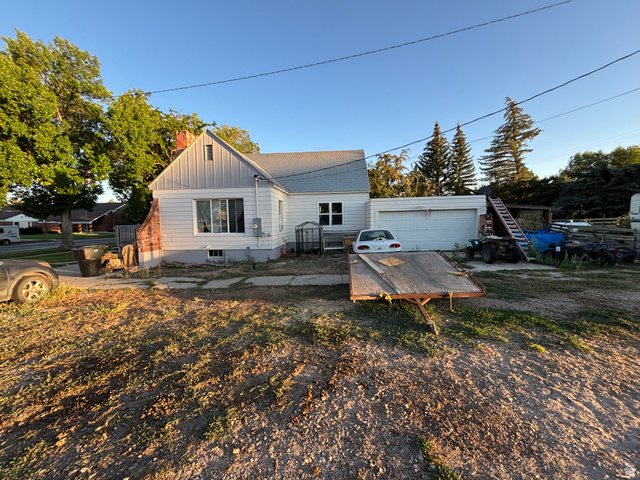 102 South Main Street Paris, ID 83261 - Photo 33 of 33 Back of property featuring board and batten siding and a garage