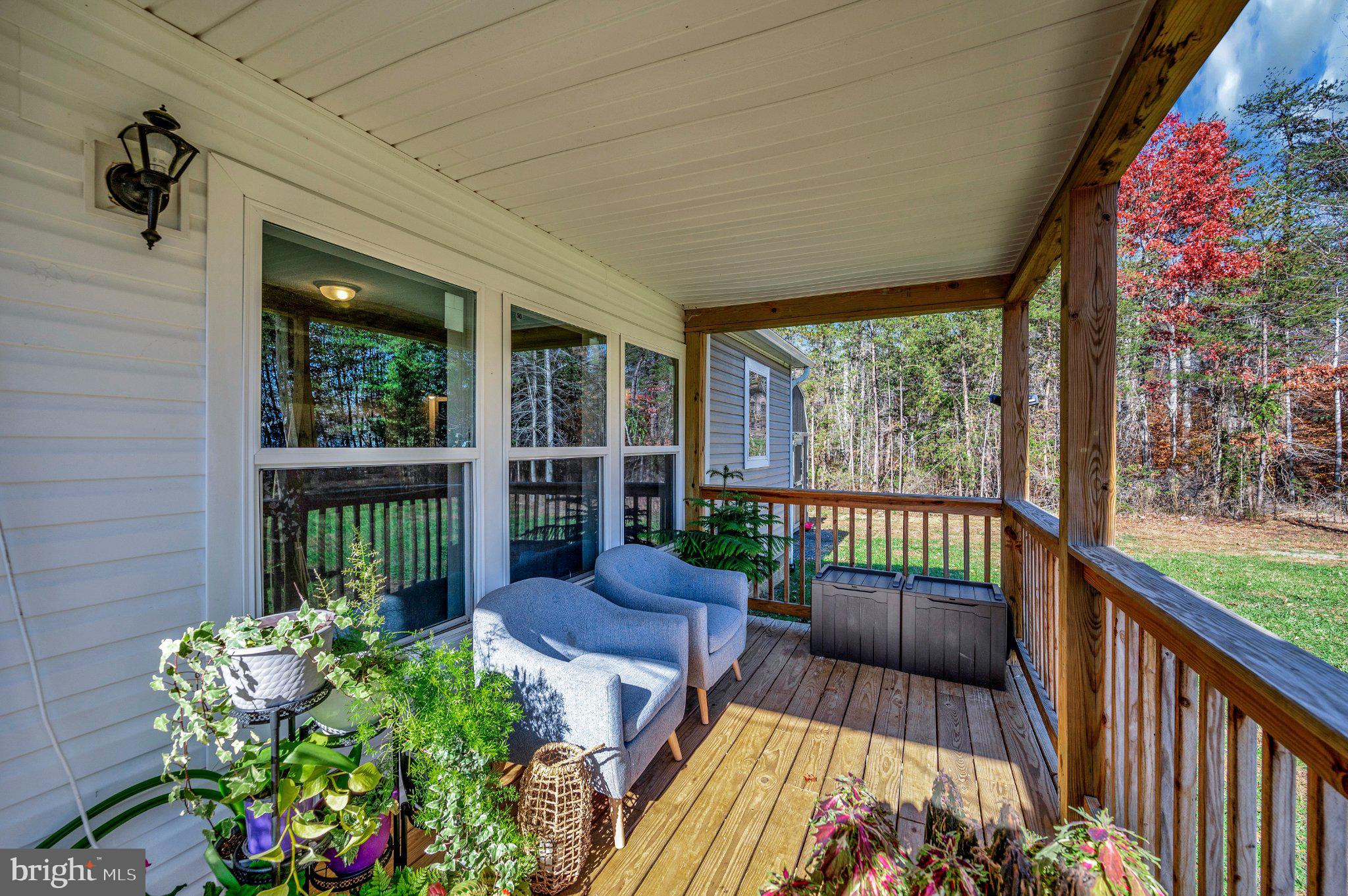 5120 Burr Hill Road Rhoadesville, VA 22542 - Photo 2 of 45 Charming porch with lush greenery.