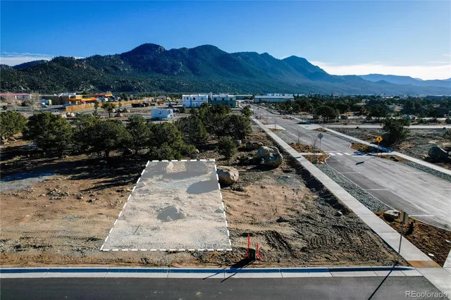 an aerial view of residential houses with city view