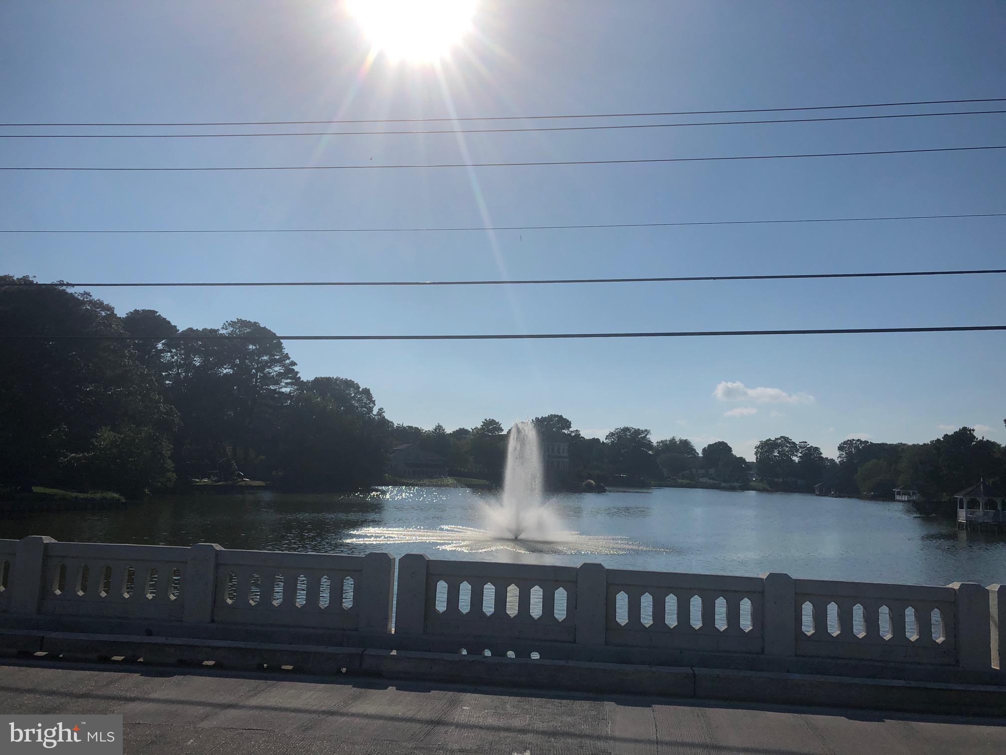 360 Bay Reach Rehoboth Beach, DE 19971 - Photo 15 of 28 a view of a lake with a mountain in the background