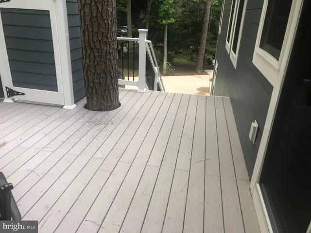 a view of a wooden deck with a bench